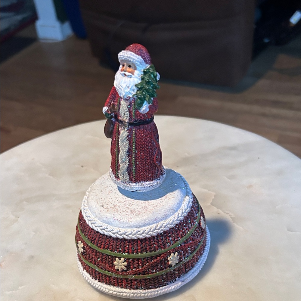 Charming musical Santa figurine that rotates plane Santa Claus is coming to town